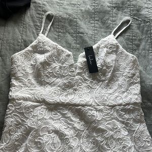 Lulus white dress with lace overlay. New with tags. Never worn.